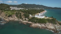 Drone Orbit Aerial Of Lighthouse In Puerto Rico Surf And Ocean Coastline