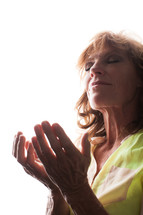 woman with open palms on prayer and worship 