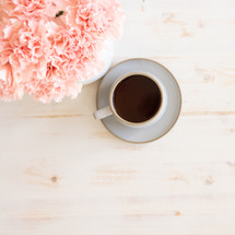 pink carnations and coffee cup 