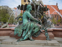 BERLIN, GERMANY - APRIL 24, 2010: The Neptunbrunnen (Neptune fountain) in Alexanderplatz was designed by german sculptor Reinhold Begas in 1891