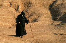 Prophet walking through the wilderness. Biblical illustration.