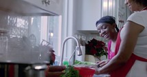 Sisters happily cook in the kitchen for Christmas