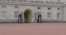 4K British Guards Standing Watch At Buckingham Pallace In London