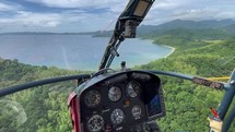 Happy Asian Helicopter Pilot Flying Over Secluded Beach In The Philippines