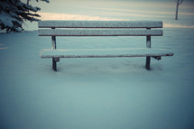 snow covered bench 