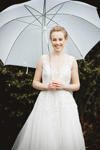 bride holding an umbrella 