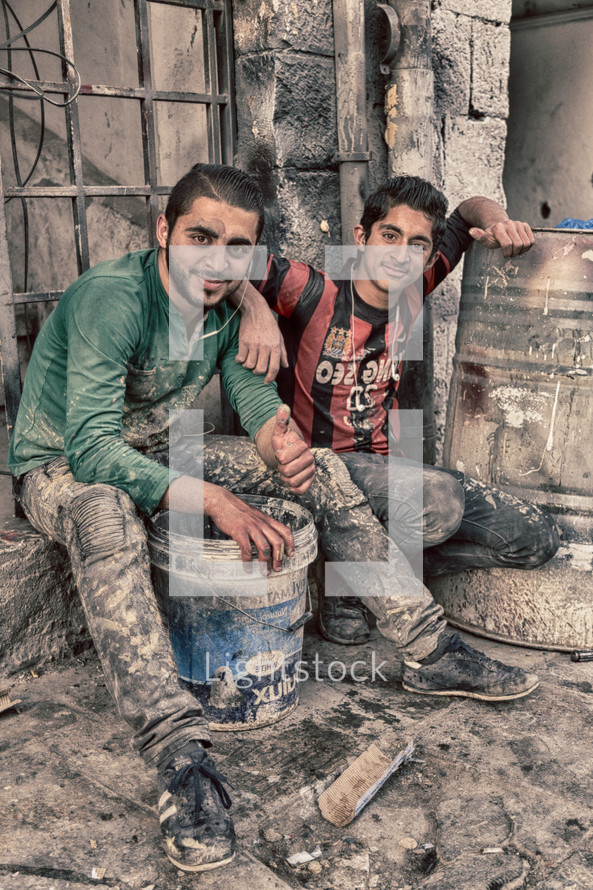 two young men brick layers 
