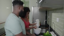 Young couple cooking in the kitchen