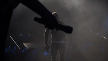 silhouette of a microphone and preacher on stage 