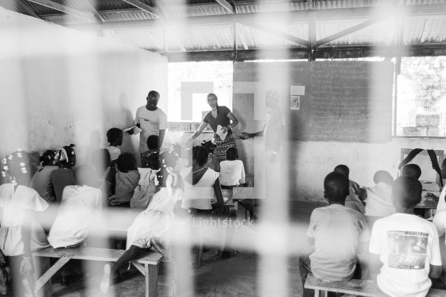 children learning in a school house 
