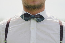 man in a bow tie and suspenders 