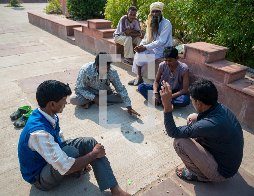 men playing marbles in India 