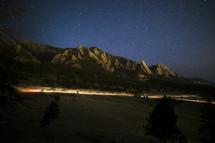 Long Exposure of the Flat Irons, Boulder Colorado as a car passes under the mountains.