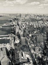Aerial view over a city in black and white