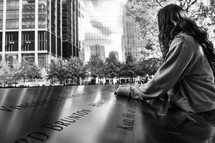 girl visiting the 9/11 memorial 