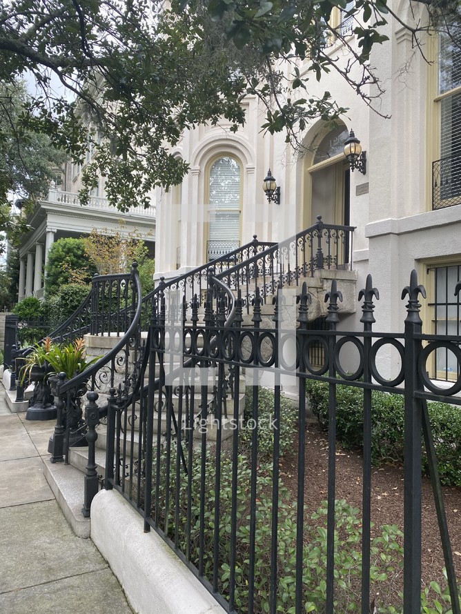 wrought iron fence in front of a house 