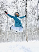 a woman celebrating in snow 