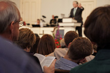 minister preaching an attentive parishioners 