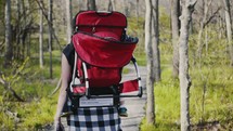 a baby hiking with mom 