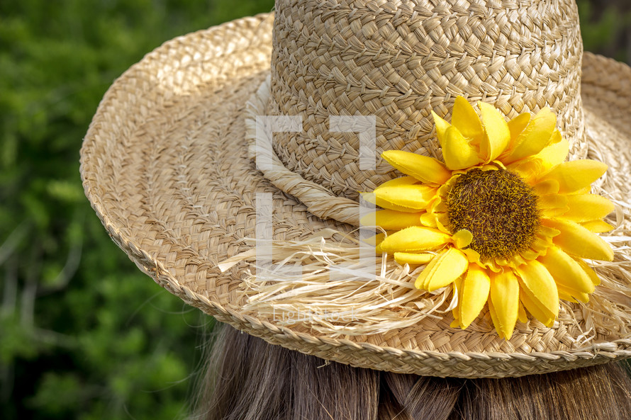 straw hat with a sunflower 