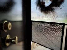 word love on a fogged up window 
