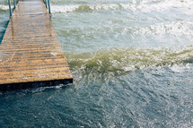 waves splashing through a dock 
