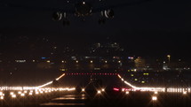 Airplane landing at night at airport