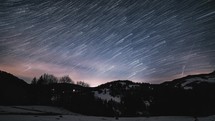 Magic beauty of startrails milky way galaxy motion above winter country in starry night sky, Astronomy Stars Time lapse