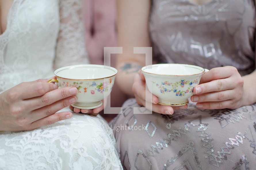 bride and bridesmaid with tea cups 
