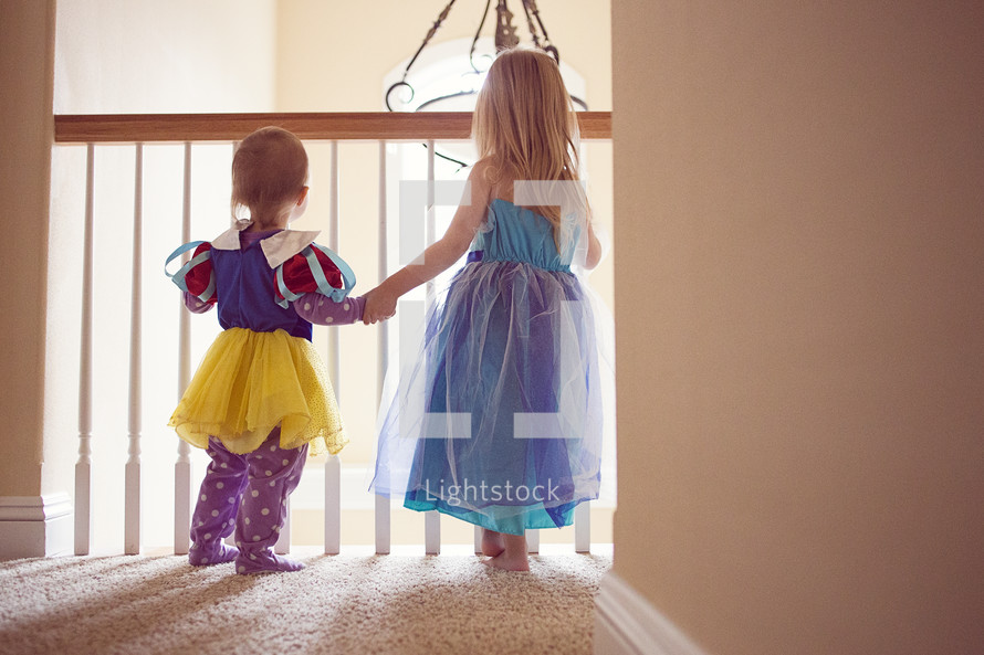 toddler girls in dress-up clothes 