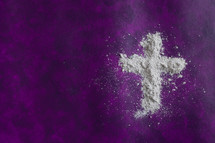 ahses in the shape of a cross on purple 