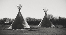 Tee Pees and picnic tables. 