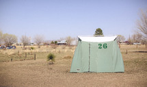 Tent in a field on farmland.