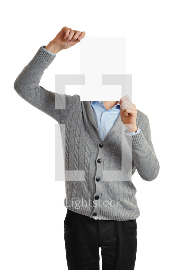 Man holding a blank page in front of his face.