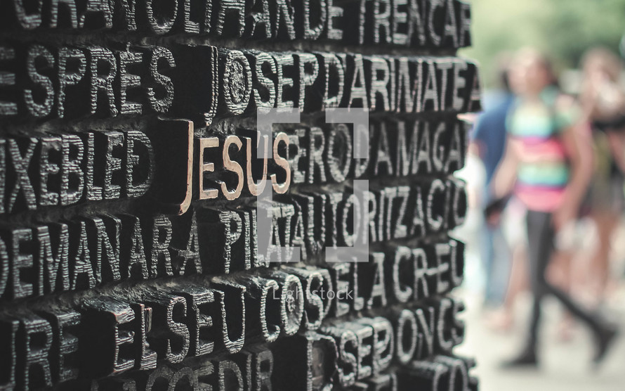 word Jesus carved on a monument 