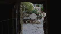 Camera looking out of Jesus Tomb in Jerusalem Tomb stone christ risen from the dead historic bible story location