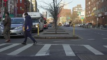 people using a crosswalk in NYC