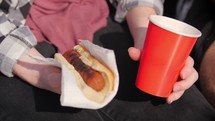 eating a hotdog at a ballpark 