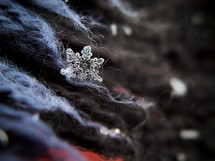 macro snowflake on wool 