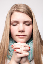 teen girl with praying hands 
