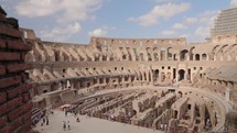  Interior view of the Colosseum an ancient amphitheater in Rome, establishment shot
