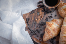 rosary, coffee and croissants 