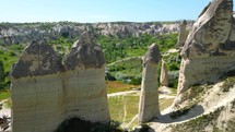 Aerial views of Imagination Valley in Cappadocia, famous touristic place with interesting rock formations.
