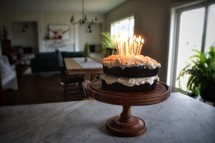 birthday candles in a birthday cake on a countertop 