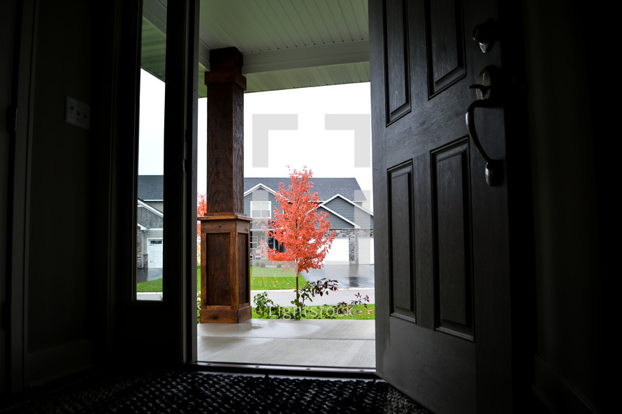 open front door and red fall tree 