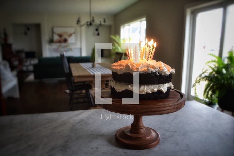birthday candles in a birthday cake on a countertop 