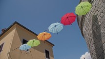 umbrellas against a blue sky