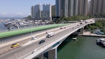 Aerial view of the bridge in Aberdeen Hong Kong. Taxis and cars moving. Hong Kong harbour,