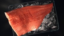 Salmon fillet with ice. Filmed is slow motion 1000 fps.