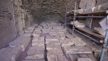 Interior view of the Colosseum an ancient amphitheater in Rome, pieces of ruins, archeology
